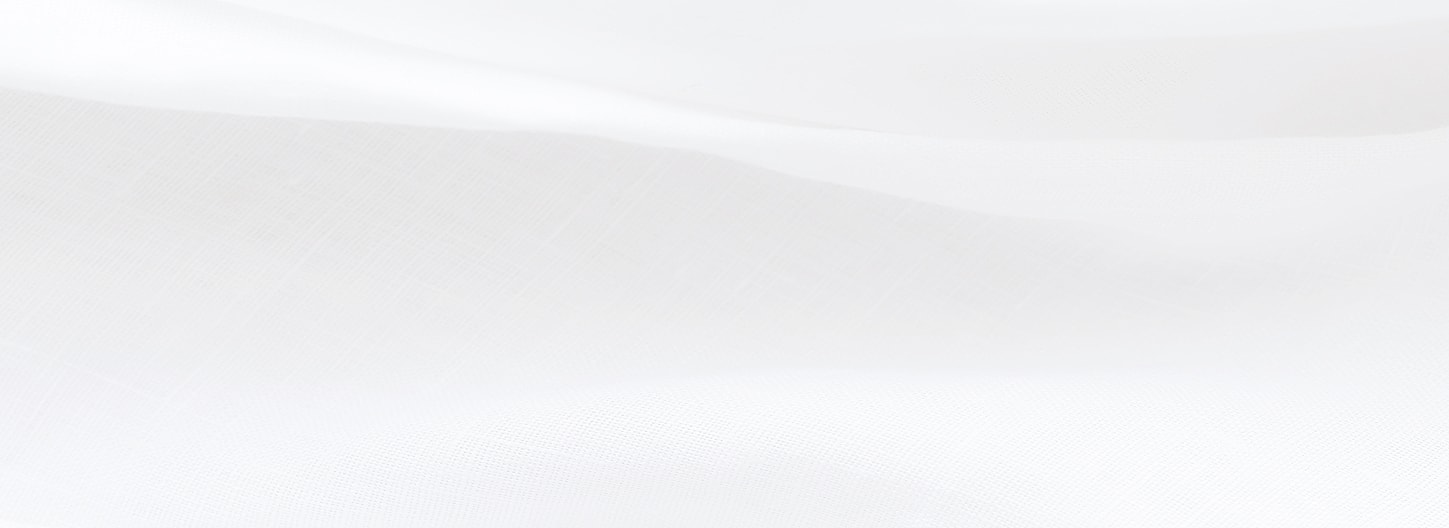 Soft, flowing white fabric texture background.