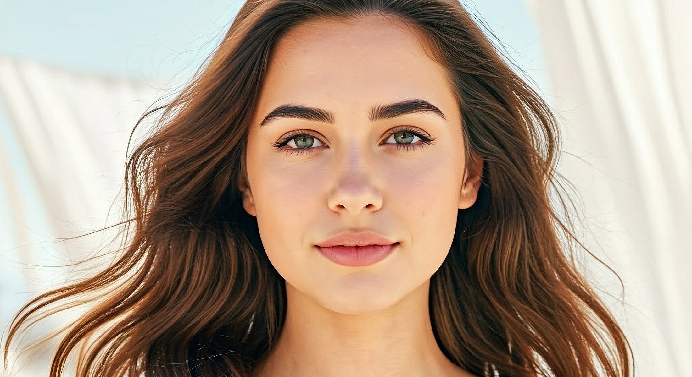 Young woman with flowing hair and natural beauty.